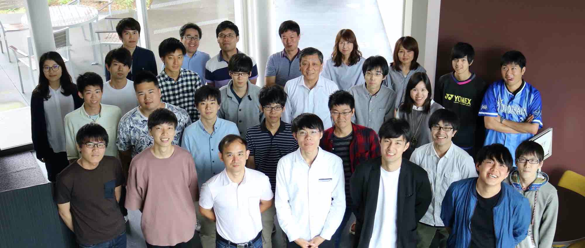 Professor Higashino's research laboratory team members at Osaka University